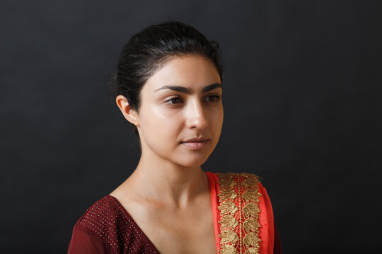 Portrait of young adult indian woman in sari.