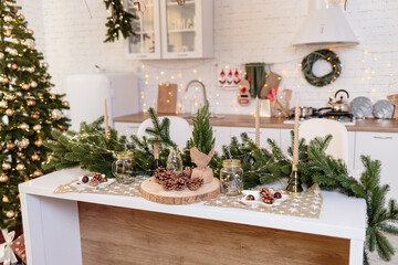 Christmas tree in the house New Year's interior in the kitchen. Decorated Christmas photo zone