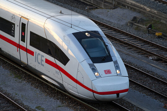 Aerial view of white and red ICE train of the DB at track field of Z&uuml;rich main station on a sunny autumn evening. Photo taken October 9th, 2021, Zurich, Switzerland.