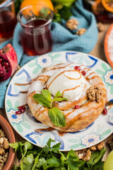 round cake in oriental style with a scoop of ice cream.