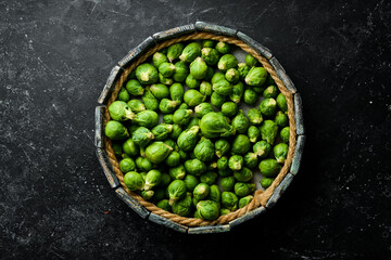 Brussels sprouts in a wooden box. Healthy food. Fresh vegetables. Top view.