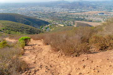 Rough dirt hiking trail in the middle of bushes at Double Peak Park, San Marcos, California © Jason