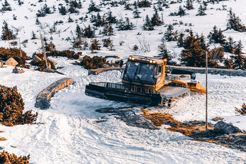 The snow groomer on the road seen from above, Giant Mountains, Poland