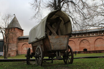 old wooden carriage at the walls of the old castle