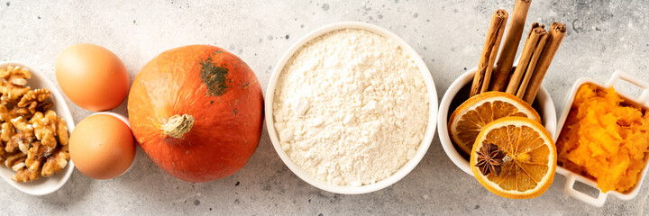 Ingredients for American pumpkin pie, blondie or bars on a light culinary background. Products for homemade traditional autumn baking top view. Banner