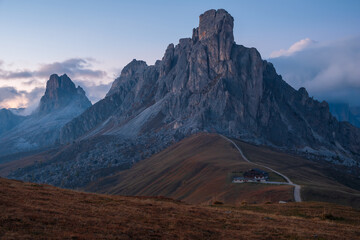 Famous Passo di Giau, Monte Gusela at behind Nuvolau gruppe the Dolomites mountains, near the famous Cortina d’Ampezzo city at sunset in South Tyrol