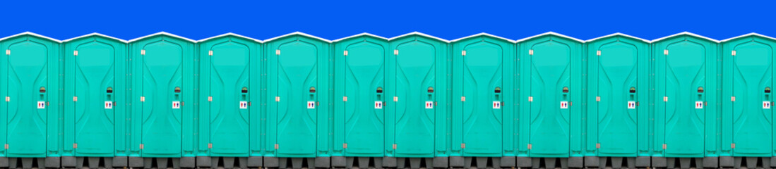 Portable mobile toilets in the park. A series of chemical toilets for holiday events. A green bio...