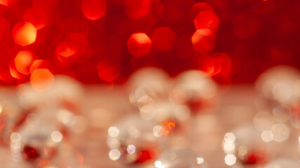 Abstract, red and white shiny circles, bokeh. Backdrop for overlay or montage, copy space with place for text. Soft, out of focus, blurred background. Christmas concept.