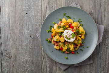 Traditional American hash with fried eggs. Top view.