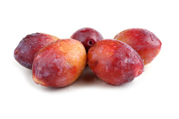 Red plums isolated on white
