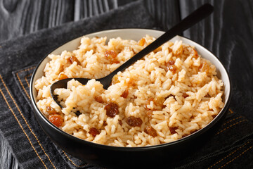 Arroz Con Coco Traditional coconut Rice Dish From Colombia close-up in a bowl on the table. horizontal