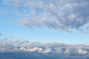 Beautiful fluffy clouds on warm sunny day