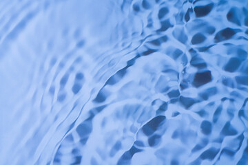 Crystal clear water surface highlighting blur of crystal clear water surface with splashes and bubbles trendy abstract nature background.
