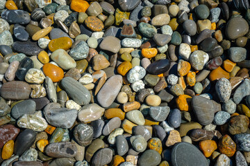 Multi colored pebbles on the beach
