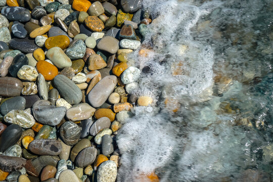 Multi Colored Pebbles On The Beach