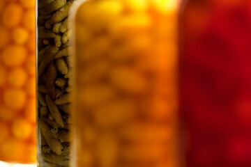 Bottled, marinated, Multi colored colorful Hot chili peppers, - food background High quality photo