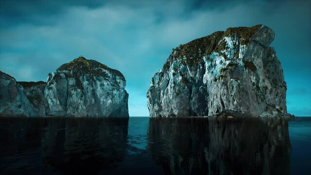 rocky cliffs in the ocean at sunny day