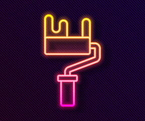 Glowing neon line Paint roller brush icon isolated on black background. Vector
