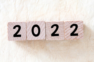 2022 year arranged from wooden liters on a light background.