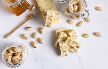 White chocolate covered nougat. Nougat with pistachios and almonds. These delicious confections are...