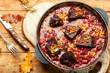 Meat stewed in autumn berries.