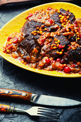 Tasty veal meat grilled with berries.