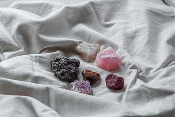Different minerals on a white background. Amethyst, tiger's eye, meteorite, quartz. Stones on a...