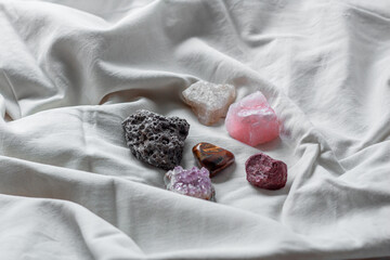 Different minerals on a white background. Amethyst, tiger's eye, meteorite, quartz. Stones on a...
