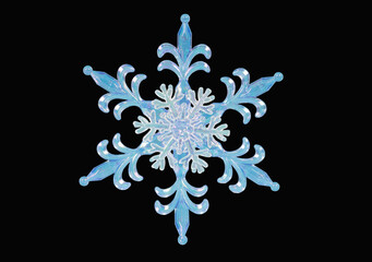 Close-up of blue snowflake on black isolated background