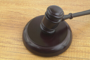 Judge gavel on wooden table close up. Court and justice concept.