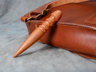 the process of processing the sides of the leather backpack