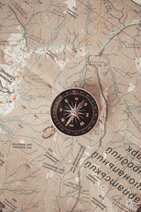 Black compass on routes on the world map discovery, navigation, communication, logistics, geography, transportation and travel theme concept background