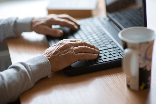 Old Man Senior Hands On Laptop Keyboard