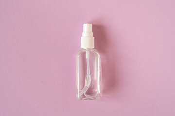 Hand sanitizer antiseptic gel on pink background.