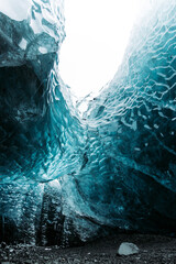 blue ice cave of Iceland glacier vertical photo