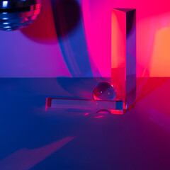 Glass prisms and a ball in neon light. Disco mirror ball. Blue, pink, purple