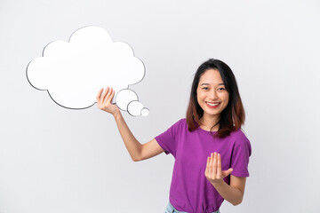 Young Vietnamese woman isolated on white background holding a thinking speech bubble and doing coming gesture