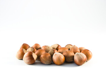 Whole hazelnuts in a shell isolated on white background with copy space