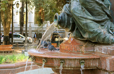 Group of Pigeons Bathing in the Vintage Fountain of Cerro Santa Lucia Foothill's Park in Downtown...
