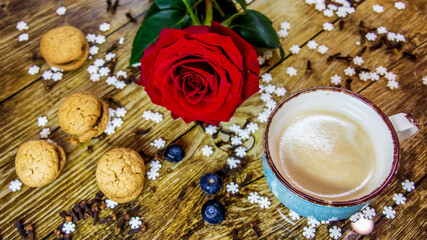 christmas coffee, cookies and red rose