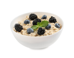 Tasty oatmeal porridge with blackberries and blueberries in bowl on white background