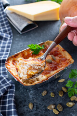 Homemade pumpkin gratin with cheese on a table