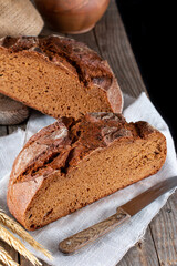 Freshly baked rye bread on wooden board. Homemade sourdough bread.