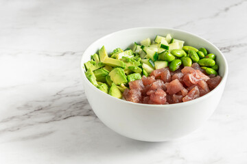Poke bowl with delicious salmon, green peas and avocado. Healthy food concept. High quality photo