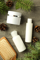 Composition with winter cosmetic products on gray textured table