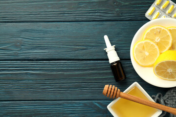 Flu treatment accessories on wooden table, space for text
