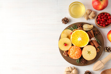 Ingredients for cooking mulled wine on white wooden background