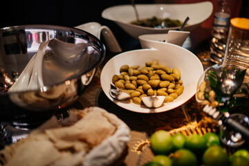 Obraz na płótnie Canvas festive table in focus plate with olives