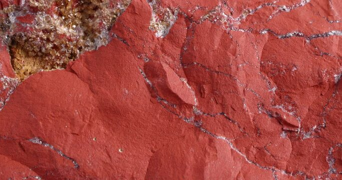 Jastic is red. Close-up of the structure of the stone. Semi-precious ornamental stone.