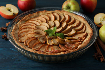Concept of tasty food with apple pie on wooden background
